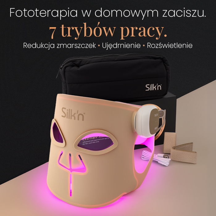 Baner reklamowy przedstawiający maskę LED Silk n. Beżowa maska z różowym podświetleniem stoi na powierzchni obok akcesoriów i czarnej kosmetyczki. Po lewej stronie znajduje się tekst promujący urządzenie, wymieniający 7 trybów pracy i korzyści, takie jak redukcja zmarszczek.