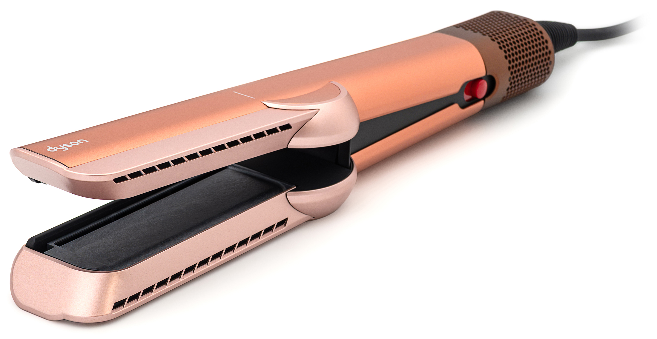 Otwarta aeroprostownica Dyson Airstrait w kolorze Amber Silk na białym tle. Widok z boku ukazuje rozchylone ramiona urządzenia, czerwony przycisk blokady na korpusie oraz dolny pierścień wentylacyjny z przewodem.