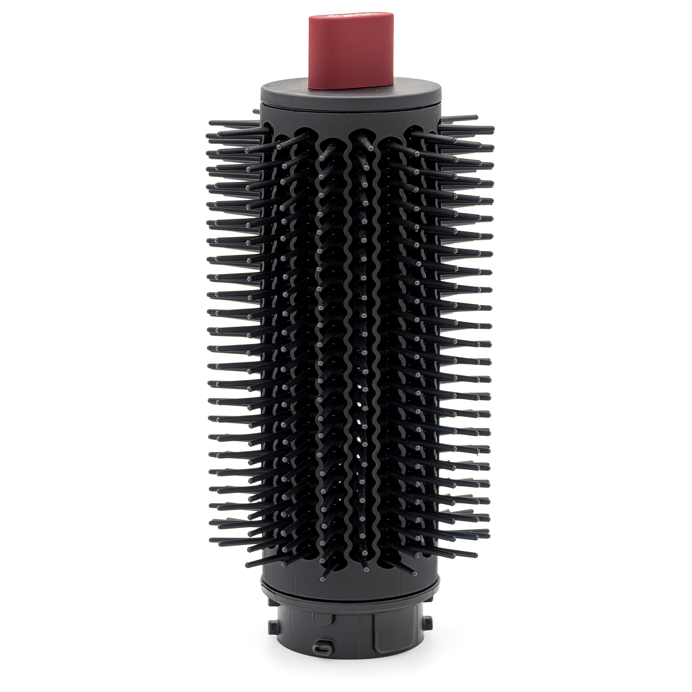 Okrągła szczotka do nadawania objętości Dyson Airwrap. Widoczny cylindryczny korpus z gęstymi, czarnymi ząbkami, czerwony element na szczycie oraz złącze montażowe u podstawy.