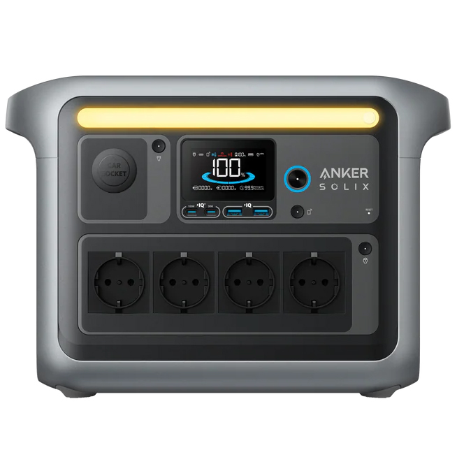 Czarna stacja zasilania Anker SOLIX C1000 z wbudowanym ekranem LCD i listwą oświetleniową. Na przednim panelu widoczne są liczne porty ładowania USB i 12V, a z boku gniazda AC. Urządzenie posiada ergonomiczne uchwyty transportowe i nowoczesny, techniczny design.