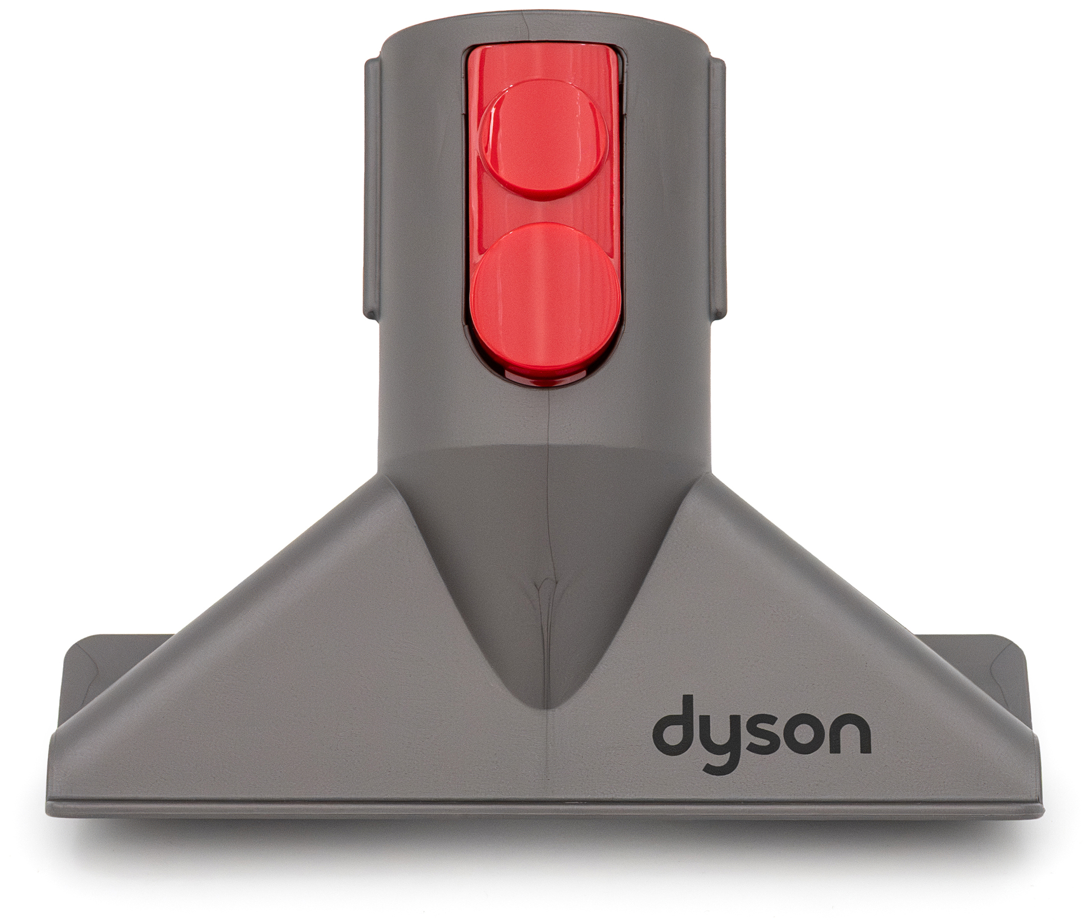 Frontalny widok ciemnoszarej szczotki do schodów Dyson o trójkątnym kształcie, z widocznym napisem dyson na podstawie. W górnej części znajdują się dwa duże, czerwone przyciski do mocowania i zwalniania.