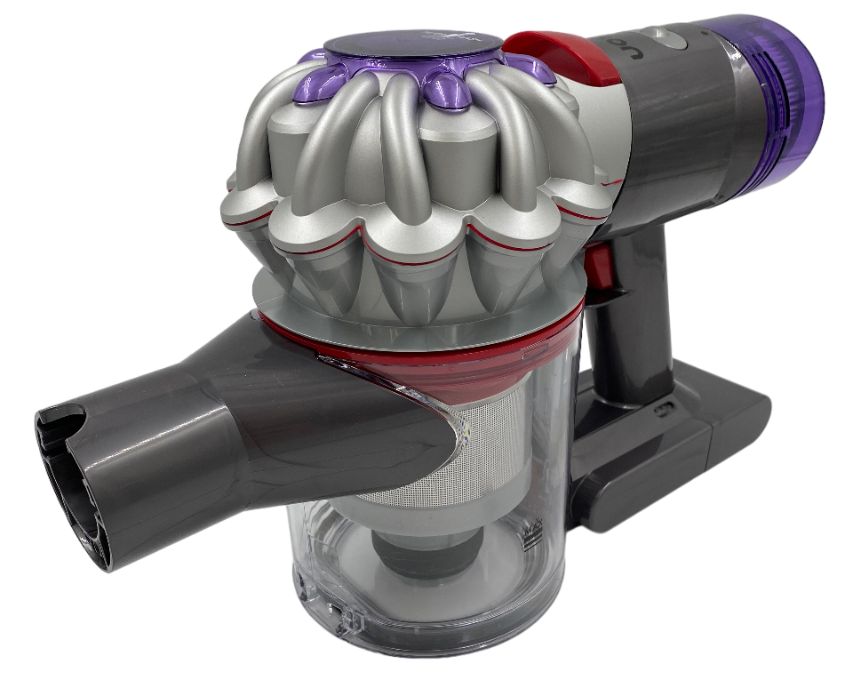 Główna jednostka odkurzacza Dyson V8 Advanced, z widocznym przezroczystym pojemnikiem na kurz, rurą mocowania i fioletowym filtrem. Urządzenie ma szaro-srebrny kolor z czerwonymi akcentami.