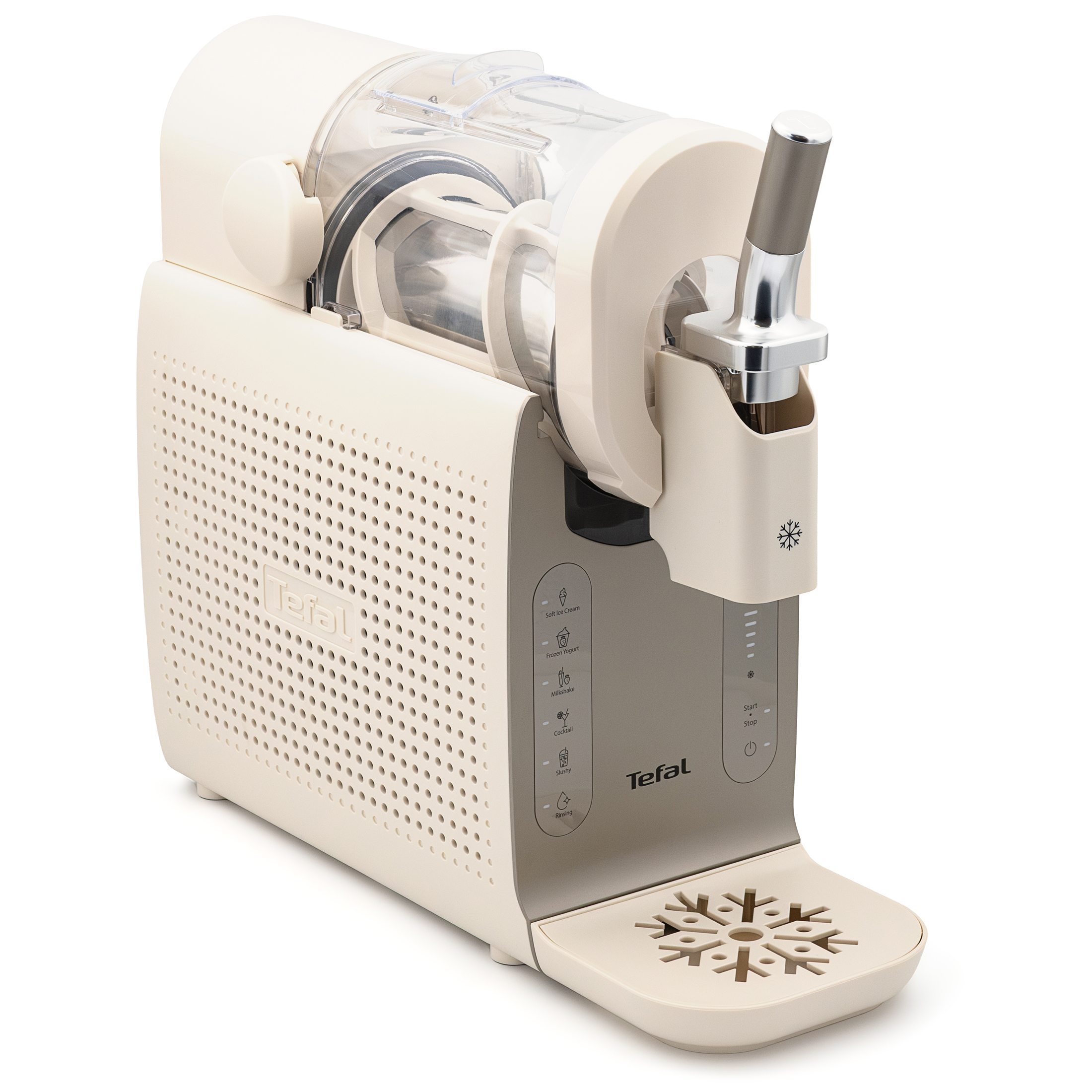 Maszyna do robienia lodów Tefal Freezi IG803AE0 zaprezentowana pod lekkim kątem na białym tle, bez dodatkowych akcesoriów. Podłużna obudowa urządzenia w kolorze jasnobeżowym łączy się z metaliczną dźwignią dozującą oraz pionowym panelem sterowania z ikonami programów. W dolnej części widoczna jest pusta, wysunięta tacka ociekowa z dekoracyjną kratką w kształcie dużej śnieżynki.