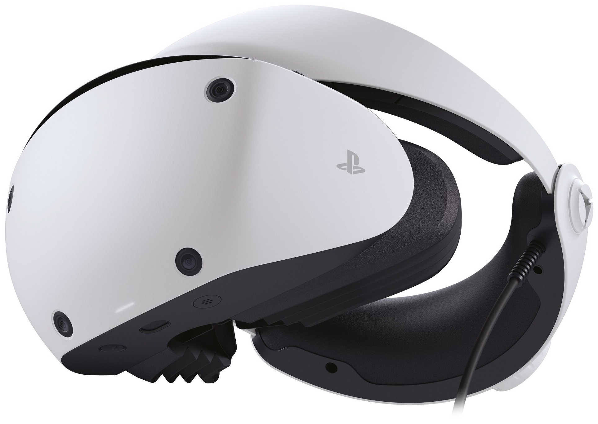 Gogle wirtualnej rzeczywistości Sony PlayStation VR2 przedstawione z profilu na białym tle, w ujęciu bez dodatkowych kontrolerów czy opakowania. Widoczna jest opływowa konstrukcja obudowy w kolorach białym i czarnym, wbudowane obiektywy kamer na froncie oraz profilowana opaska na głowę z grubą poduszką. Z dolnej części gogli odprowadzony jest czarny przewód połączeniowy.