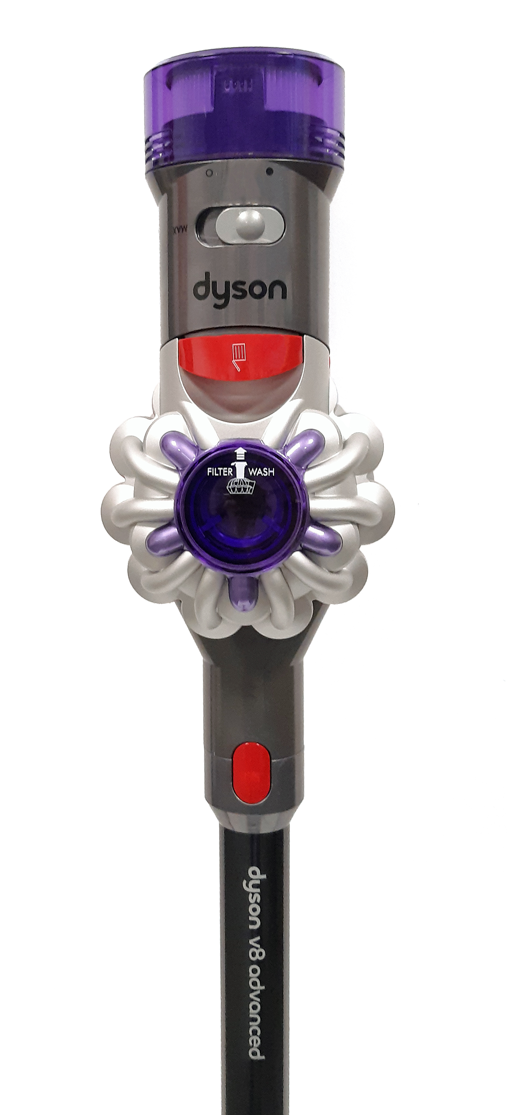 Zbliżenie na szarą jednostkę odkurzacza Dyson V8 Advanced. Widać fioletowy filtr, przezroczysty pojemnik na kurz oraz czerwony przycisk do jego opróżniania.
