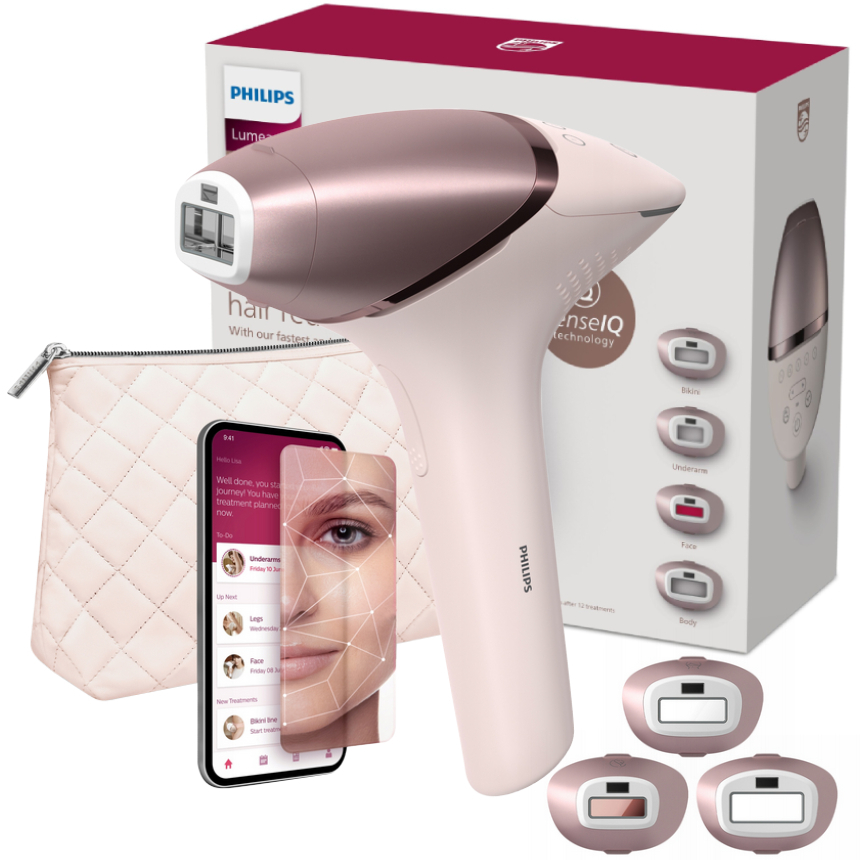 Zestaw do depilacji Philips Lumea 9900 BRI977/00 SenseIQ w kolorze różowego złota z białą rączką, opakowaniem, kosmetyczką, smartfonem i trzema nakładkami.