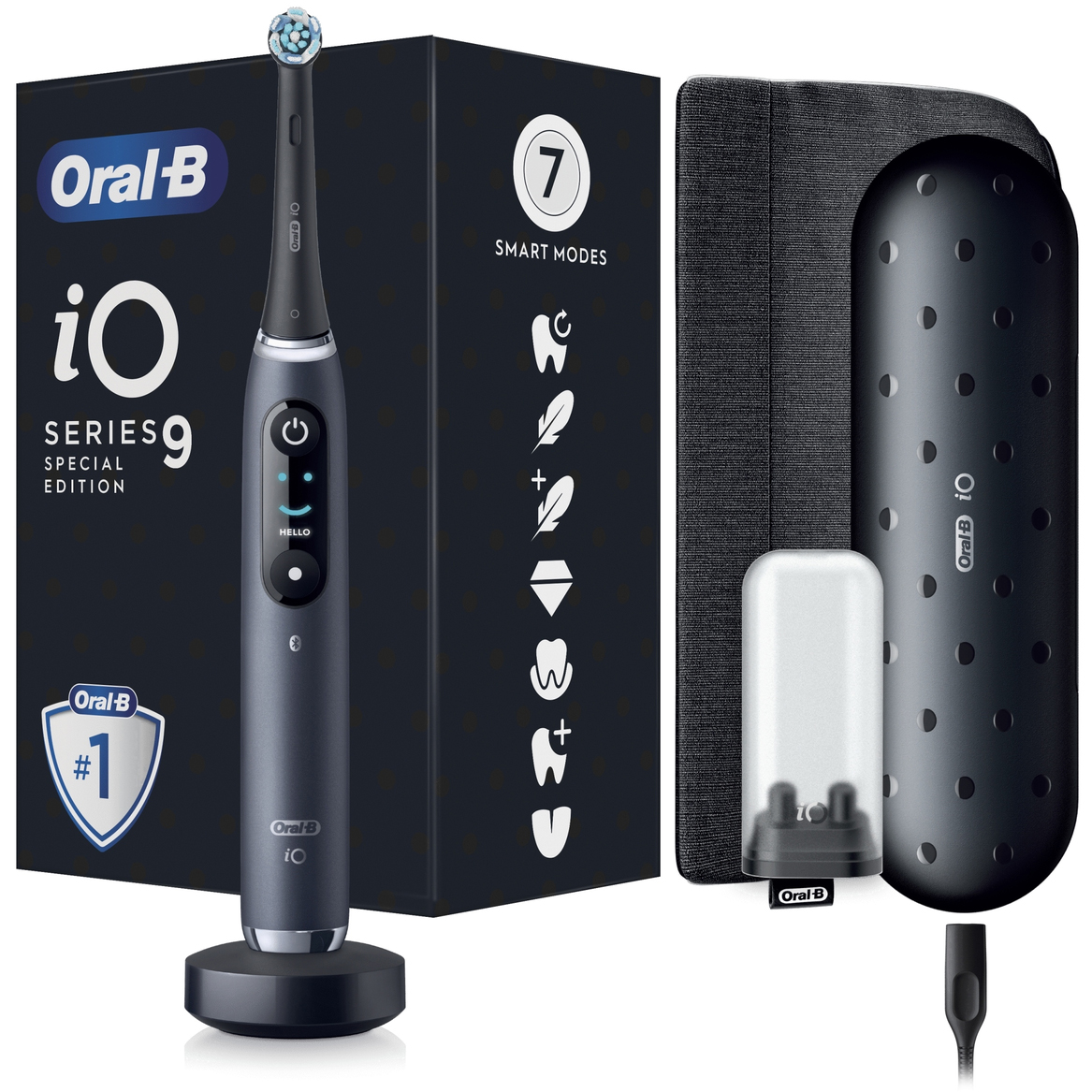 Zestaw szczoteczki magnetycznej Oral-B iO Series 9 Special Edition z grafitową rączką na podstawce ładującej, czarnym etui podróżnym w wypukłe kropki, materiałowym pokrowcem i pojemnikiem na końcówki, na tle czarnego pudełka.